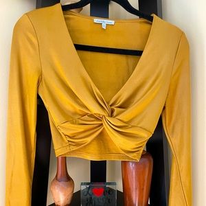 Brand new crop top
Unworn 
Color: mustard yellow 
Size: women’s small